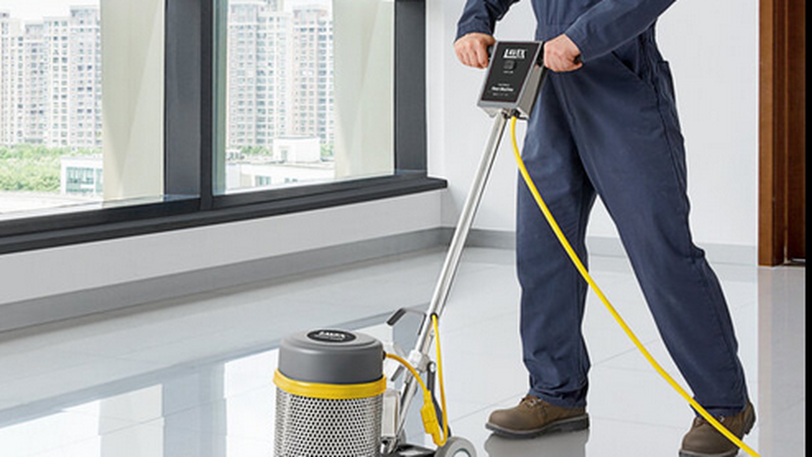 Team in green aprons cleaning a home